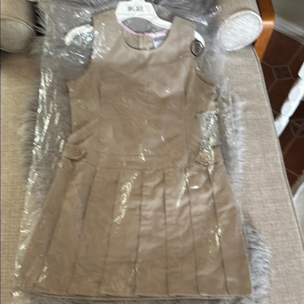 NWT Still in plastic cover with original tags and hanger. School uniform